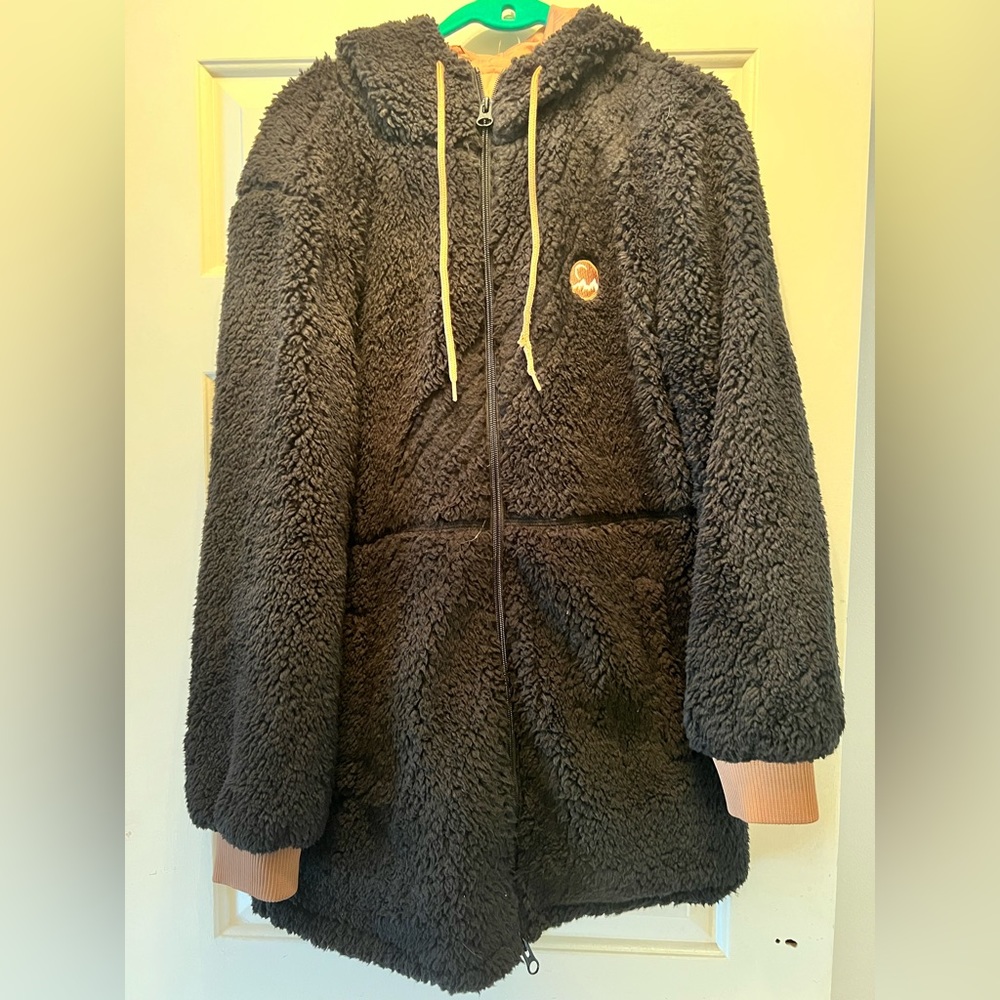 A Black and Tan Zyia long Teddy jacket. Size Large